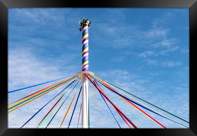 The Woved Coloured Ribbon Patterns On The Maypole Framed Print by Peter Greenway