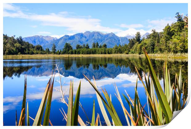 Mountain reflections in Lake Matheson Print by Kevin Hellon