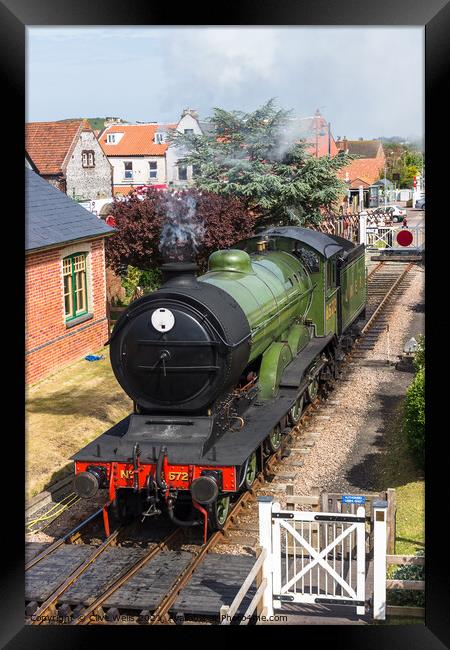 Steam train waiting. Framed Print by Clive Wells