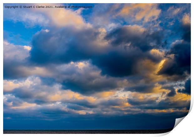 Sunset in the clouds Print by Stuart C Clarke