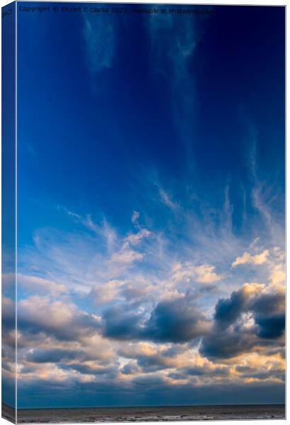 Sunset in the clouds Canvas Print by Stuart C Clarke
