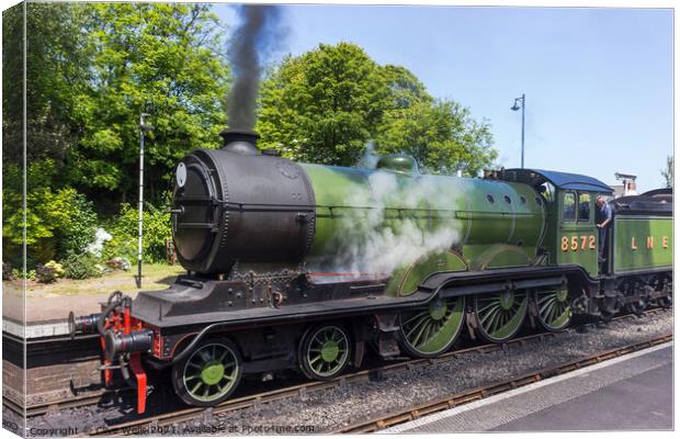 Old steam train fired up and ready to go. Canvas Print by Clive Wells
