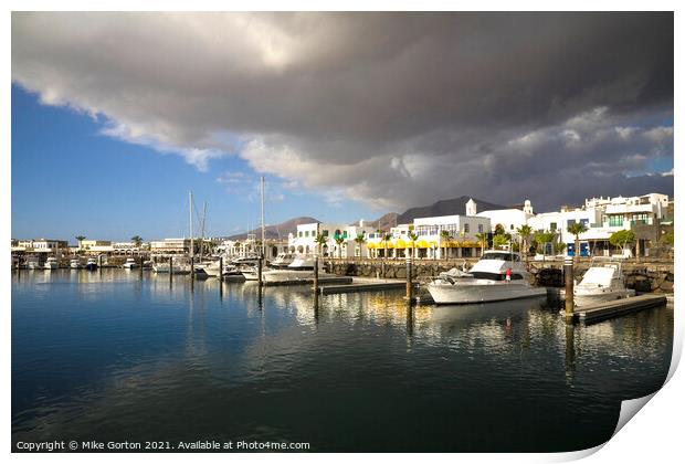 Storm clouds over Playa Blanca Marina Lanzarote Print by Mike Gorton