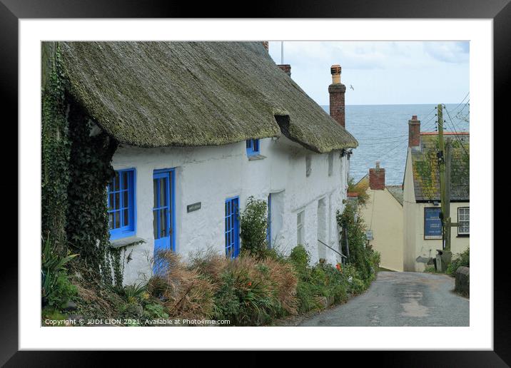 Thatched cottages by the sea Framed Mounted Print by JUDI LION