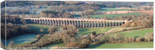 Red train 2 at Ouse valley Viaduct Canvas Print by Paul Hutchings