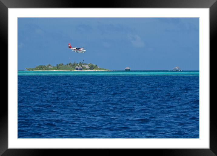 Sea plane landing on water in Maldives Framed Mounted Print by mark humpage