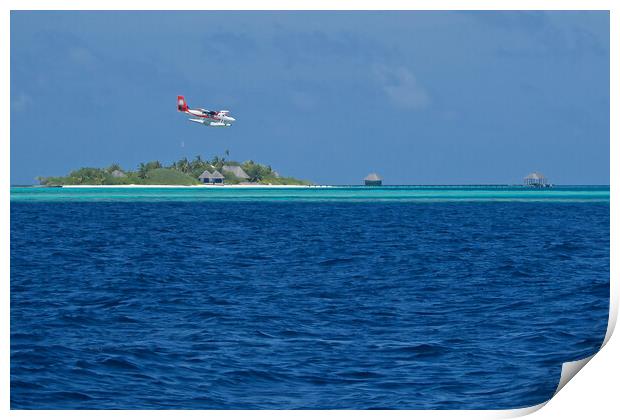 Sea plane landing on water in Maldives Print by mark humpage