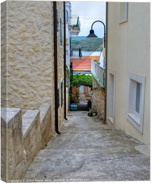 Primosten Old town back street Croatia Canvas Print by Diana Mower