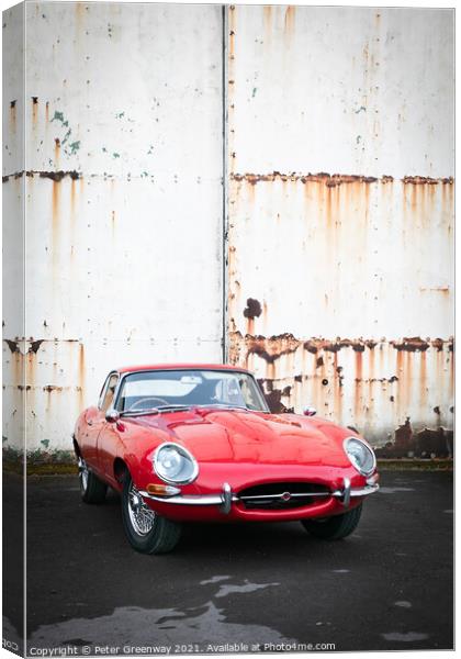 Red Classic Sports Car Rusty Hangar Doors Canvas Print by Peter Greenway