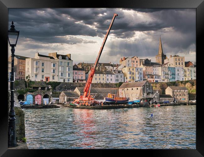 Putting the boats in Tenby Harbour Framed Print by Paul Deverson