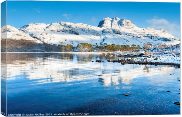 Slioch reflected in the waters of Loch Maree Canvas Print by Justin Foulkes