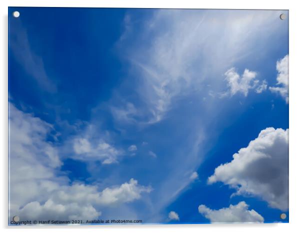 Fluffy white cloud shapes at blue sky. Acrylic by Hanif Setiawan