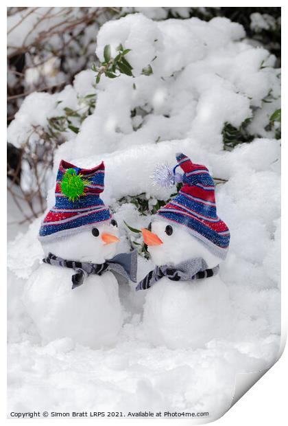 Two cute little snowmen dressed for snow Print by Simon Bratt LRPS