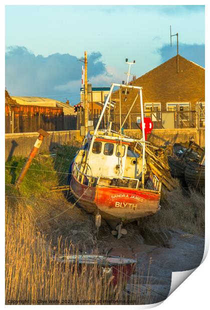 Small fishing boat stuck on the mud Print by Clive Wells