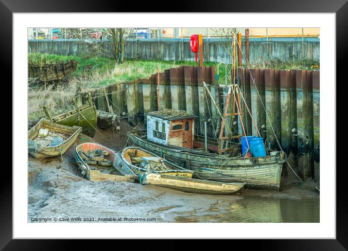 Abandoned boats at low tide Framed Mounted Print by Clive Wells