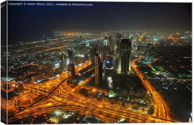 A night time view over Dubai, UAE, seen from the Burj Khalifa Canvas Print by Navin Mistry