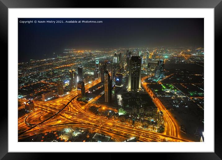 A night time view over Dubai, UAE, seen from the Burj Khalifa Framed Mounted Print by Navin Mistry