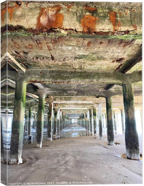 Under the pier Canvas Print by suzie Attaway