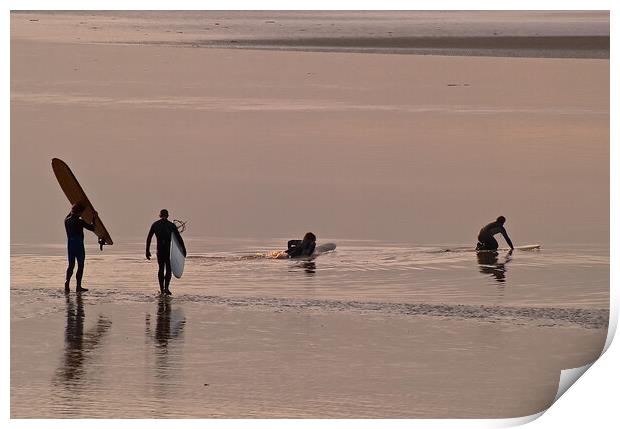 Surfers walking out to water with surfboards Print by mark humpage