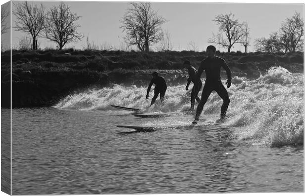 Surfers riding a wave on the river Severn Canvas Print by mark humpage