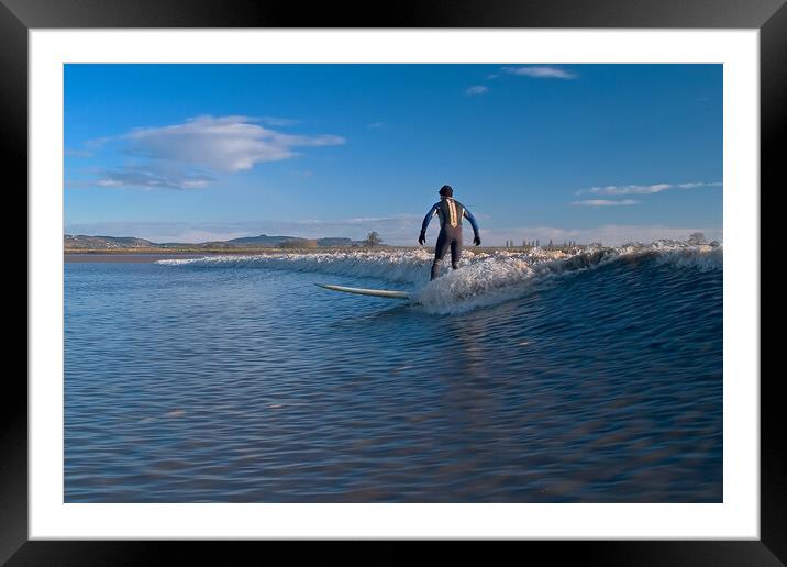 Lone surfer riding a wave on the river Severn Framed Mounted Print by mark humpage