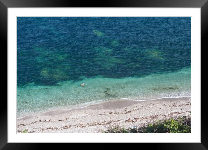 Person swimming in clear blue sea, Devon Framed Mounted Print by mark humpage