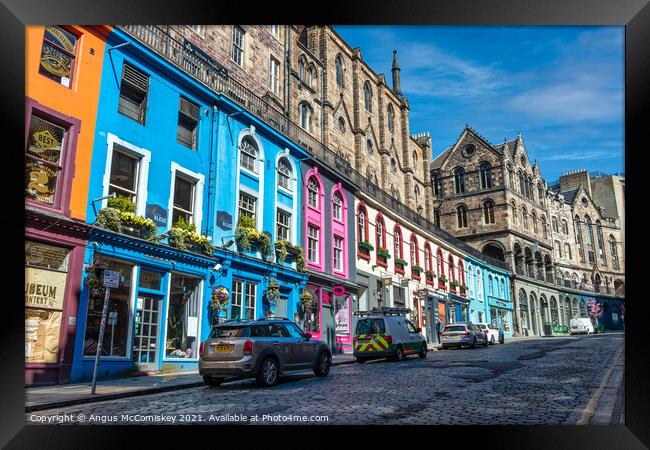Colourful shopfronts on Victoria Street, Edinburgh Framed Print by Angus McComiskey