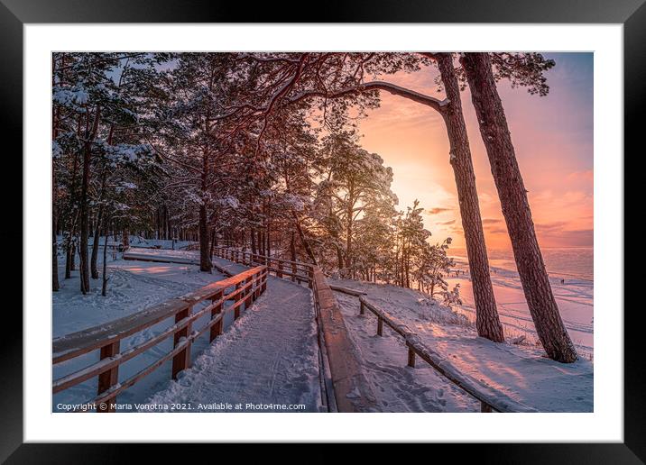 Winter landscape with sunset over covered in snow  Framed Mounted Print by Maria Vonotna