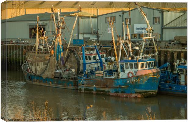 Two fishings boats at low tide Canvas Print by Clive Wells