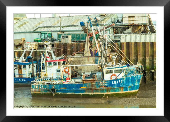 Grounded fishing boat Framed Mounted Print by Clive Wells