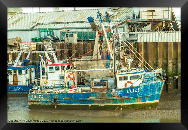 Grounded fishing boat Framed Print by Clive Wells