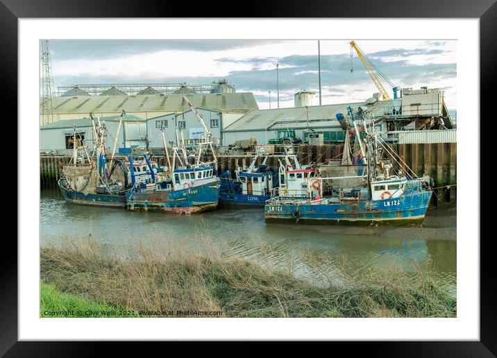 Line up of fishing boats Framed Mounted Print by Clive Wells