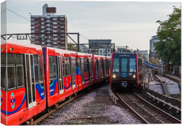 Trains passing on the DLR Canvas Print by Jason Wells