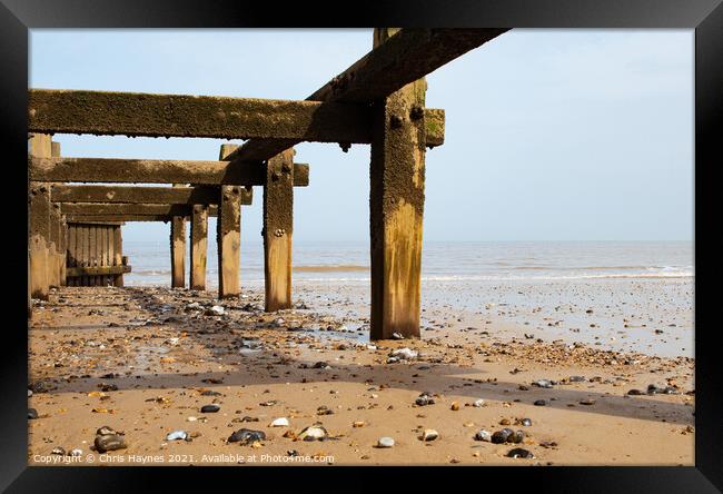 Cromer Beach, The North Sea and the defence Framed Print by Chris Haynes