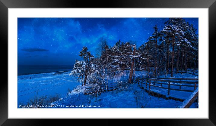 Nighttime winter scene near sea coast Framed Mounted Print by Maria Vonotna