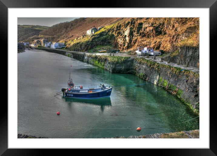 Solitary Fishing Boat Moored In Cornish Port Framed Mounted Print by Dave Bell