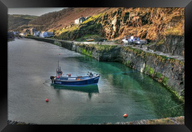 Solitary Fishing Boat Moored In Cornish Port Framed Print by Dave Bell