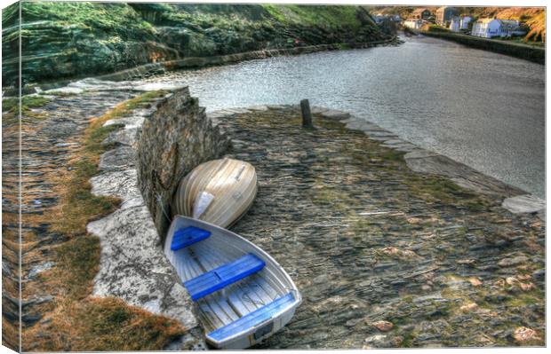 Dinghy's Parked on sea wall Canvas Print by Dave Bell