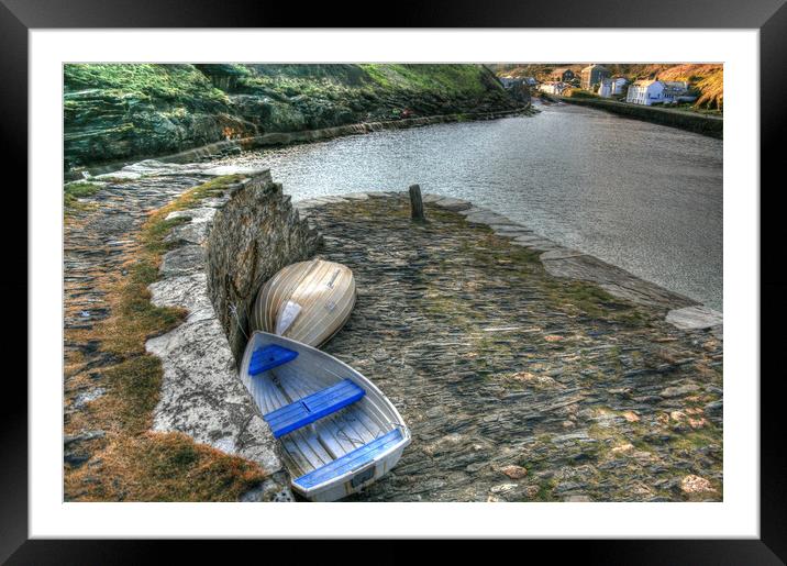 Dinghy's Parked on sea wall Framed Mounted Print by Dave Bell