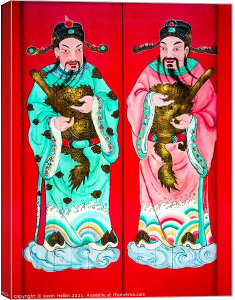 Chinese figure on doors Canvas Print by Kevin Hellon