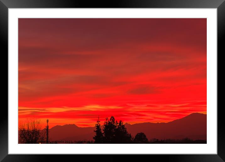 a spectacular sunset over the mountains paints the sky of red Framed Mounted Print by susanna mattioda