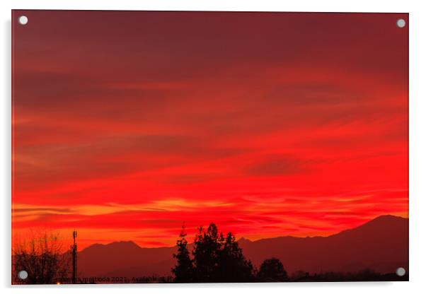 a spectacular sunset over the mountains paints the sky of red Acrylic by susanna mattioda