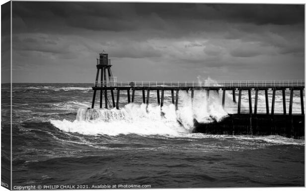 black and white picture of stormy seas at the entrance to Whitby harbour 488.  Canvas Print by PHILIP CHALK