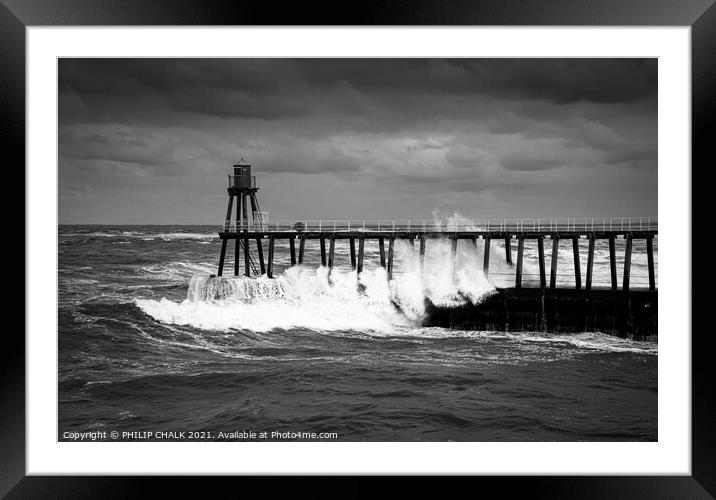 black and white picture of stormy seas at the entrance to Whitby harbour 488.  Framed Mounted Print by PHILIP CHALK