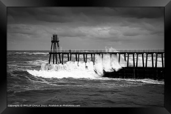 black and white picture of stormy seas at the entrance to Whitby harbour 488.  Framed Print by PHILIP CHALK
