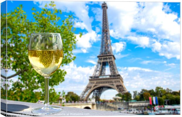 Glass of white wine with Eiffel tower view Canvas Print by Maria Vonotna