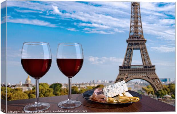 Red wine with snacks against Paris Eiffel tower Canvas Print by Maria Vonotna