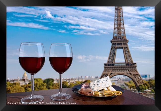 Red wine with snacks against Paris Eiffel tower Framed Print by Maria Vonotna