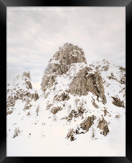 Mountain rocky peak in the snow Framed Print by Paolo Cordoni