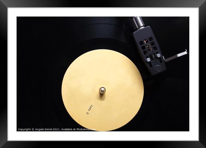 Side B Vinyl on a Turntable Framed Mounted Print by Angelo DeVal